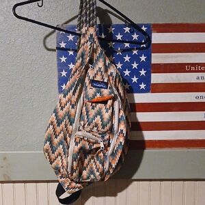 Kavu Geometric Rope Sling Bag in Orange, Green & Tan